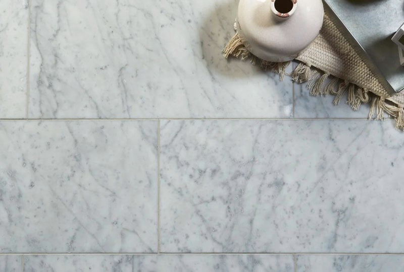 A close-up of Carrara marble floor tiles